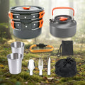 Collection of camping cookware and utensils including pots, cups, and cutlery