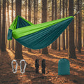 Green and blue hammock set with carabiners, ropes, and carrying bag