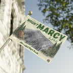 Mount Marcy flag with mountain illustration and text on a building facade - Adirondack Summit Flag