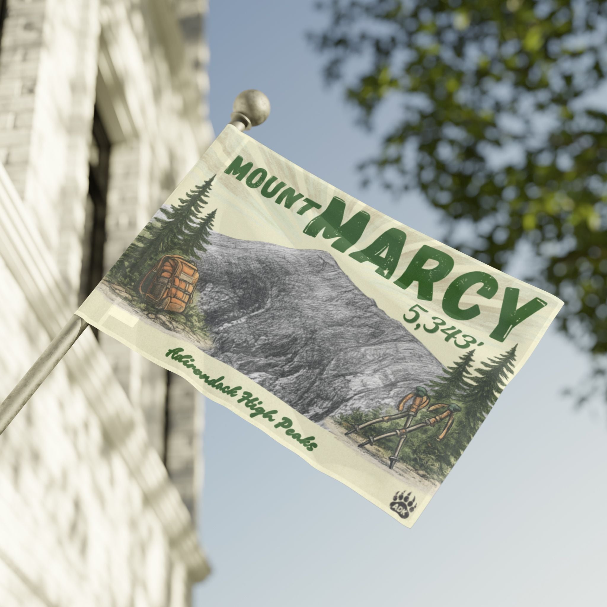 Mount Marcy flag with mountain illustration and text on a building facade - Adirondack Summit Flag