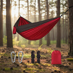 Red and black hammock set with carabiners, ropes, and carrying bag