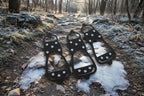 black microspikes on an icy trail, offered by the best hiking gear store in New York, The Adirondack Tool Co.