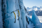 Two black and yellow ice climbing axes offered by The Adirondack Tool Co.