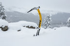 Yellow ice axe with black and silver components on a white background, offered by The Adirondack Tool Co.