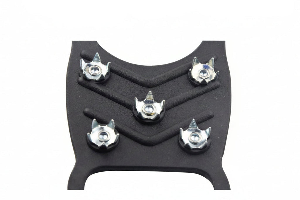 Black microspikes on a white background with text "high strength teeth" - offered by the best hiking gear store in New York, The Adirondack Tool Company