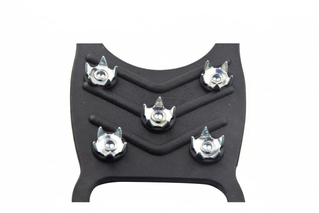 Black microspikes on a white background with text "high strength teeth" - offered by the best hiking gear store in New York, The Adirondack Tool Company