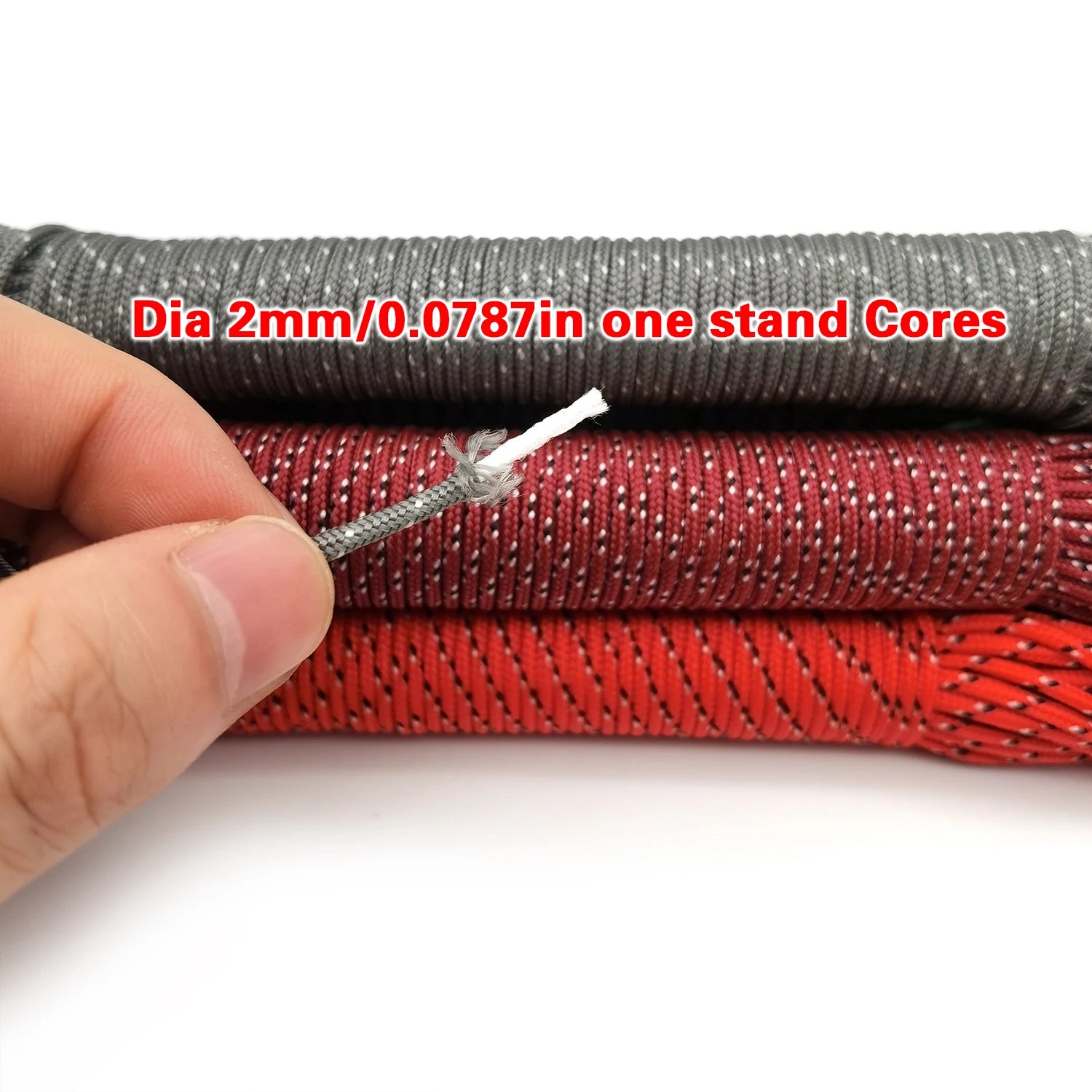 Black and red 2mm paracord rope with a hand displaying the core - offered by the best hiking and camping gear store in Vermont, The Adirondack Tool Co.