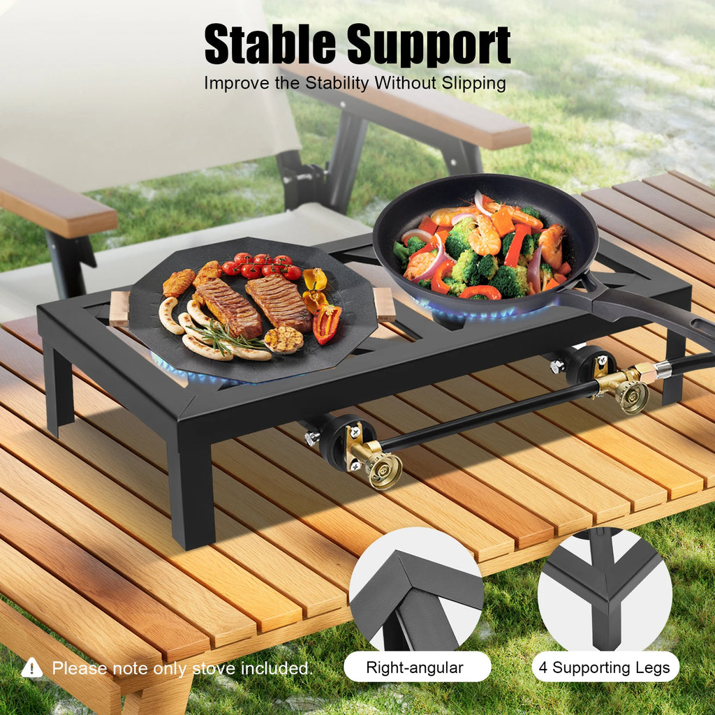 Portable stove with two burners on a wooden table outdoors, featuring stable support design. Offered by The Adirondack Tool Co.
