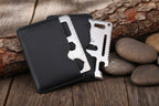 Card-sized stainless steel multi-tool with black synthetic leather case on a white background