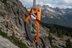 Orange rock climbing ascender with black handle on a white background - offered by the best climbing gear store in the northeast, The Adirondack Tool Co.