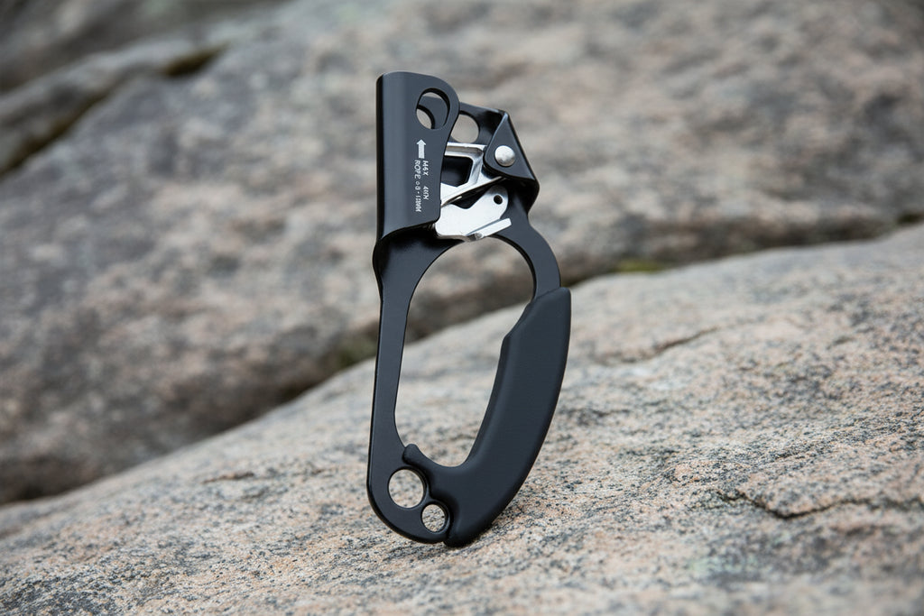 Black and silver carabiner on a white background - offered by the best climbing gear store in the northeast, The Adirondack Tool Co.