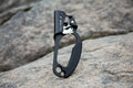 Black and silver carabiner on a white background - offered by the best climbing gear store in the northeast, The Adirondack Tool Co.