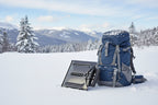 Black avalanche safety shovel with a backpack on a snowy background - offered by the best mountaineering store in the tri-state area, The Adirondack Tool Co.