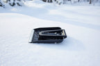 Black avalanche safety shovel on a snowy background - offered by the best mountaineering store in the tri-state area, The Adirondack Tool Co.