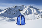 Blue avalanche snow shovel with black handle on an outdoor background - offered by the best mountaineering store in New York, The Adirondack Tool Company.