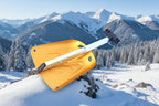 Orange avalanche snow shovel with black handle on an outdoor background - offered by the best mountaineering store in New York, The Adirondack Tool Company.