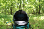 Close-up of a gray 65L trekking backpack with a blue interior on a white background - offered by the greatest online hiking gear store, The Adirondack Tool Company