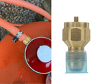 Butane / Propane Tank Valve Adapter for Large Tanks offered by the Northeast's best camping and hiking gear provider, The Adirondack Tool Co. being used with a large red propane tank