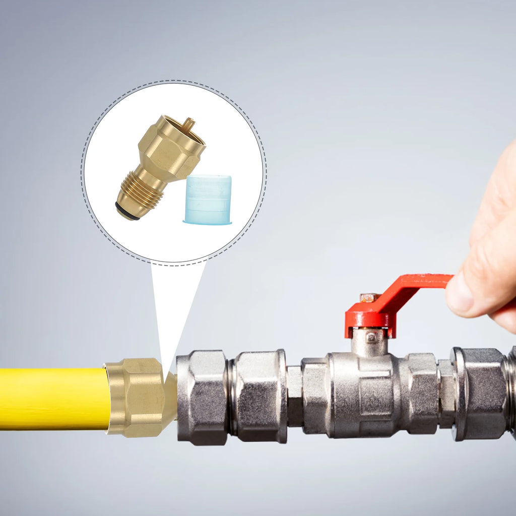 Hand adjusting a valve on a pipe with a close-up of a Butane / Propane Tank Valve Adapter for Large Tanks offered by the Northeast's best camping and hiking gear provider, The Adirondack Tool Co.