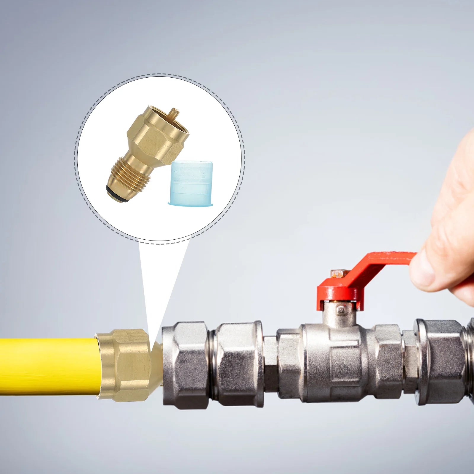 Hand adjusting a valve on a pipe with a close-up of a Butane / Propane Tank Valve Adapter for Large Tanks offered by the Northeast's best camping and hiking gear provider, The Adirondack Tool Co.