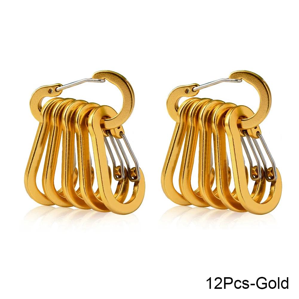 Set of gold carabiners on a white background - offered by the best hiking store in New York, The Adirondack Tool Company