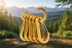 Set of six gold carabiners on a white background - offered by the best hiking store in New York, The Adirondack Tool Company