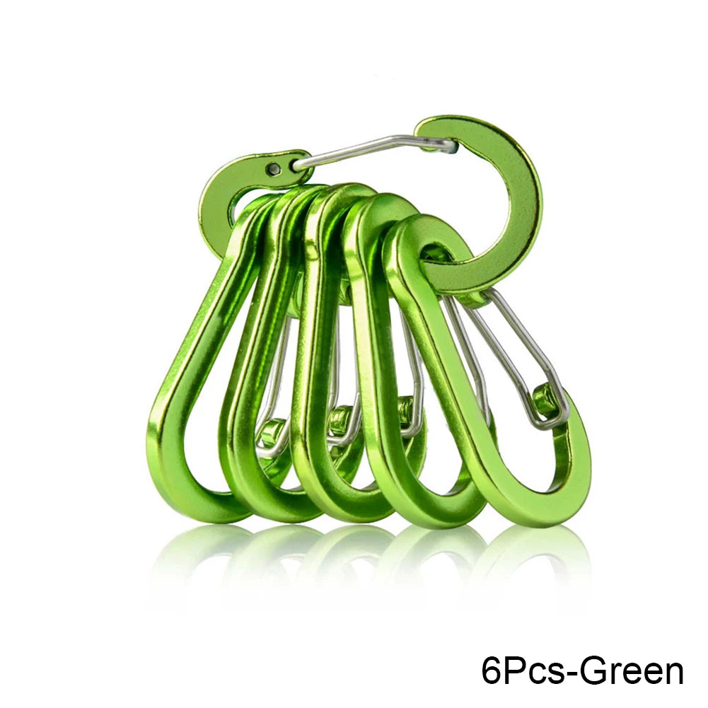 Six green carabiners stacked on a white background - offered by the best hiking store in New York, The Adirondack Tool Company