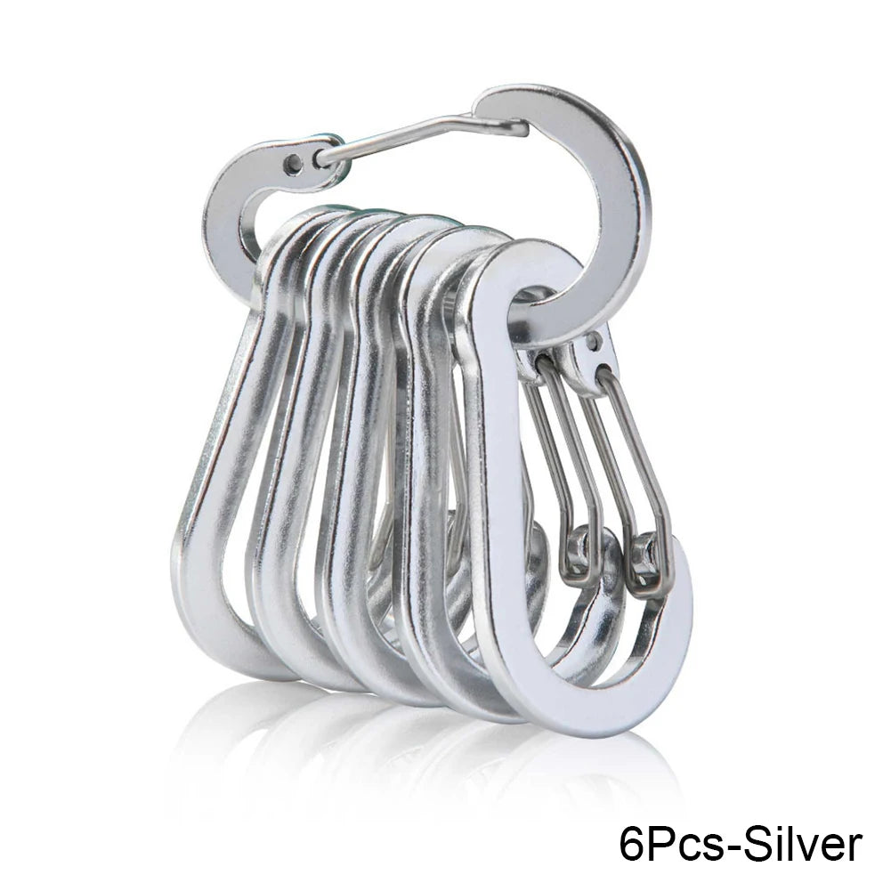 Set of six silver carabiners stacked on a white background - offered by the best hiking store in New York, The Adirondack Tool Company