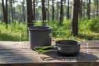 Two gray camping pots with green handles and measurements on a white background - offered by the best hiking and camping gear store in Buffalo, New York, The Adirondack Tool Co. 