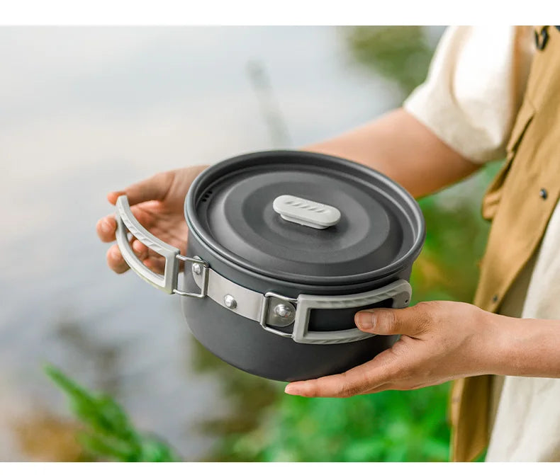 An aluminum pot with a foldable grip - offered by the best camping gear store in New York, The Adirondack Tool Company