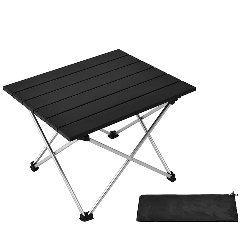 Black folding table with silver legs and a black carrying bag on a white background - offered by the best hiking and camping gear store in the Appalachian region, The Adirondack Tool Co.