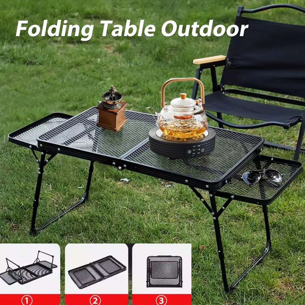 Folding table outdoor with black steel mesh surface on grass - offered by the most trusted outdoor gear and tool company in Boston, The Adirondack Tool Co.