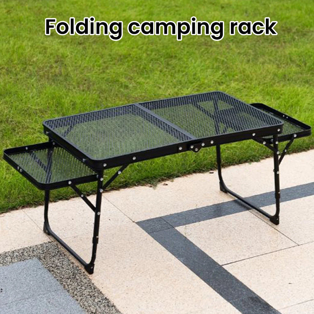 Folding camping table on a paved surface with grass in the background - offered by the most trusted outdoor gear and tool company in Boston, The Adirondack Tool Co.