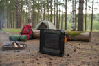 Foldable camping table on a grassy background - offered by the most trusted outdoor gear and tool company in Boston, The Adirondack Tool Co.