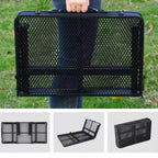 Black mesh folding camping table held by a person outdoors with additional views of the chair on a white background  - offered by the most trusted outdoor gear and tool company in Boston, The Adirondack Tool Co.