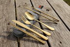 Gold camping cutlery set with chopsticks and a case on a white background - offered by the best camping and hiking gear store in the United States, The Adirondack Tool Co.