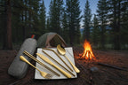 Gold camping cutlery set with a case on a textured surface - offered by the best camping and hiking gear store in the United States, The Adirondack Tool Co.