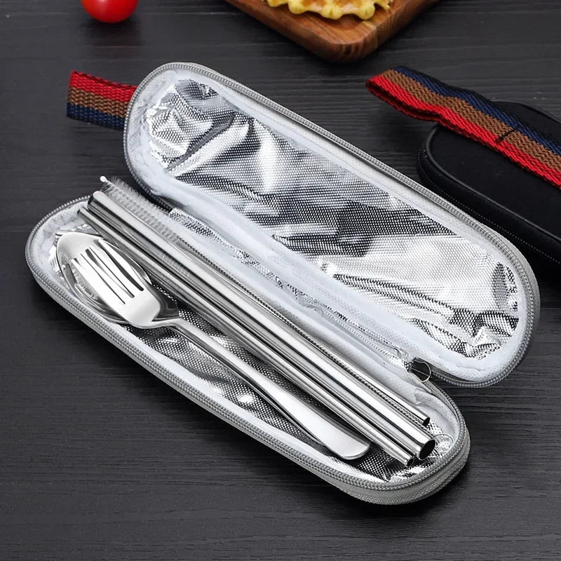 Stainless steel travel and camping cutlery set in a mesh pouch on a dark surface - offered by the best camping and hiking gear store in the United States, The Adirondack Tool Co.