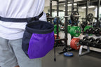 Person wearing a black and purple chalk bag on a camouflage background - offered by the best hiking and climbing gear store in New Hampshire, The Adirondack Tool Co.