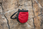 Red and black chalk bag on a white background - offered by the best hiking and climbing gear store in New Hampshire, The Adirondack Tool Co.