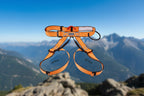 Orange climbing harness with measurement details on an outdoor background - offered by the best climbing gear store in America, The Adirondack Tool Co.