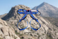 Blue climbing harness with measurements and weight on an outdoor background - offered by the best climbing gear store in America, The Adirondack Tool Co.