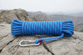 Blue rope with two carabiners on a white background - offered by the best hiking store in New York, The Adirondack Tool Co.