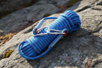 Blue climbing rope with two carabiners on a white background - offered by the best hiking store in New York, The Adirondack Tool Co.