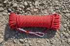 Red rope with carabiners on a rocky background - offered by the best hiking store in New York, The Adirondack Tool Co.