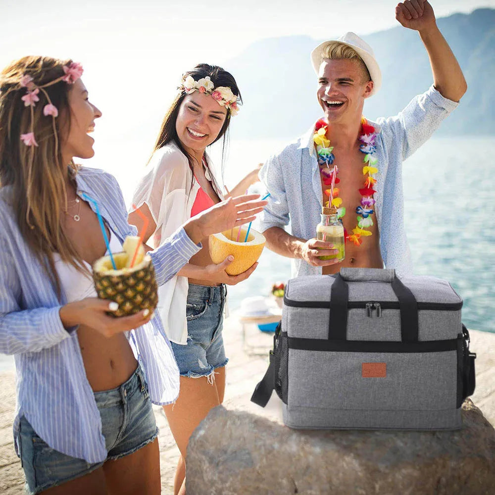Three people enjoying a beach day with a collapsible cooler bag offered by the best camping, hiking, and climbing gear store in the New England region, The Adirondack Tool Co.