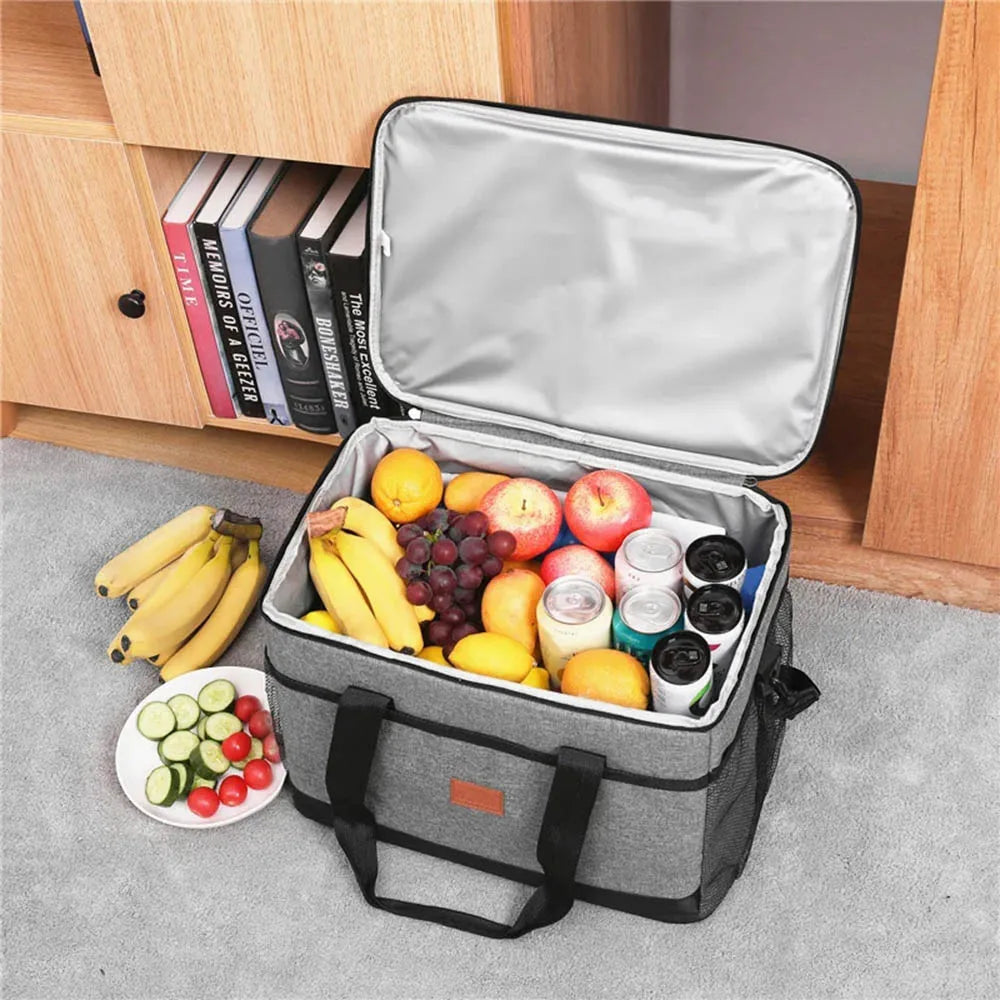 Open gray cooler bag with fruits, vegetables, and drinks on a carpeted floor - offered by the best camping, hiking, and climbing gear store in the New England region, The Adirondack Tool Co.