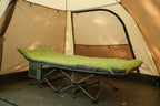 Green camping cot on a white background - offered by the best hiking and camping gear company in New York City, New York.