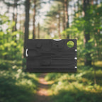 Black multi-tool card on a forest background - offered by the best outdoor gear store in New York, the Adirondack Tool Company