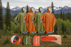 Four emergency ponchos displayed as both packed and unpacked, with a whistle feature, shown in green and orange - offered by the best camping and hiking gear store in Vermont, The Adirondack Tool Co. 